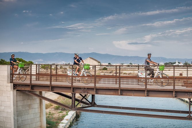 Cagliari E-Bike Tour: Gulf, Canals & Flamingos at Molentargius - Bonaria church and the harbour legend