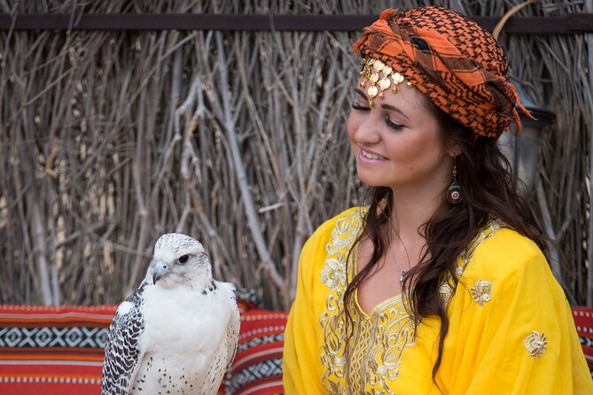 High Red Dunes with Camel Ride, Sandboarding, Falcon Show and VIP BBQ Dinner - Sandboarding on soft, forgiving sand