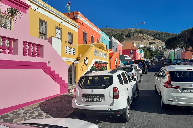 Penguins Boulders Beach and Cape Point Small Group Day Tour - Hout Bay, fishing boats, and the road south