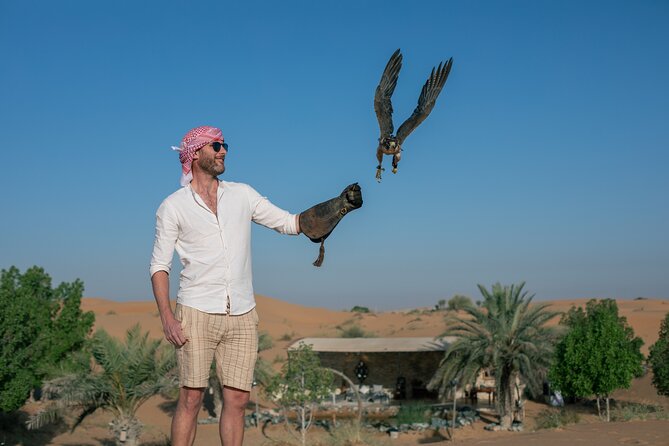 Private Falconry Experience and Nature Desert Safari in Dubai - Holding falcons and learning the old craft
