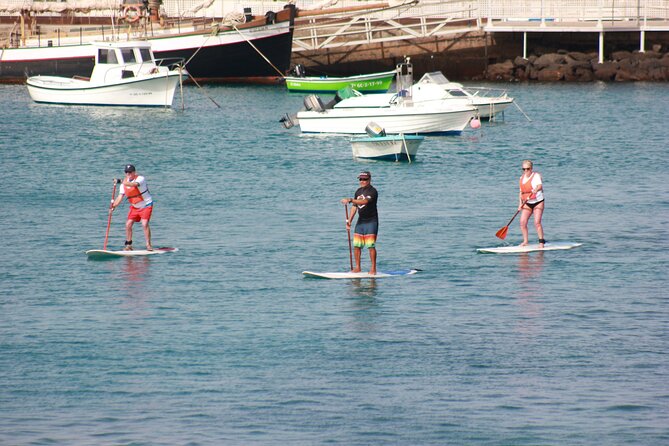 Stand Up Paddle Boarding Lesson in Playa Flamingo - From kneeling to standing in Playa Flamingo bay